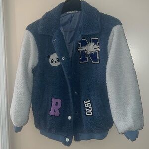 Girls jacket, size 11-12Y/ blue w/white fuzzy sleeves w/cute patches.